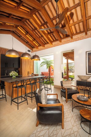 Casa Suspiros | Living area | 70-inch Smart TV with cable channels - Singular Signature Residences (Antigua Guatemala)