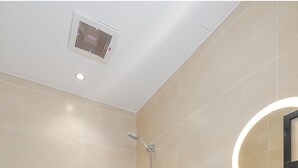 A modern bathroom with a toilet, bidet, and sink. - Stylish & Modern Apartment in Alwadi (Riyadh)