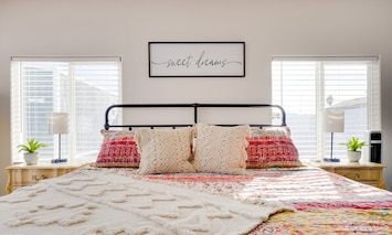 King-size bed with premium memory foam mattress and down pillows