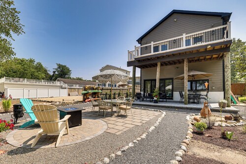 Dock + Backyard Bar: Spacious Barnegat Bay Retreat