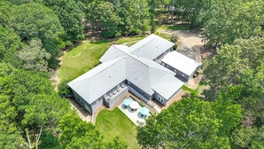A large, L-shaped building with multiple rooms and a covered patio area. - Ideal for Reunions & Retreats: Brooks Getaway! (Brooks)