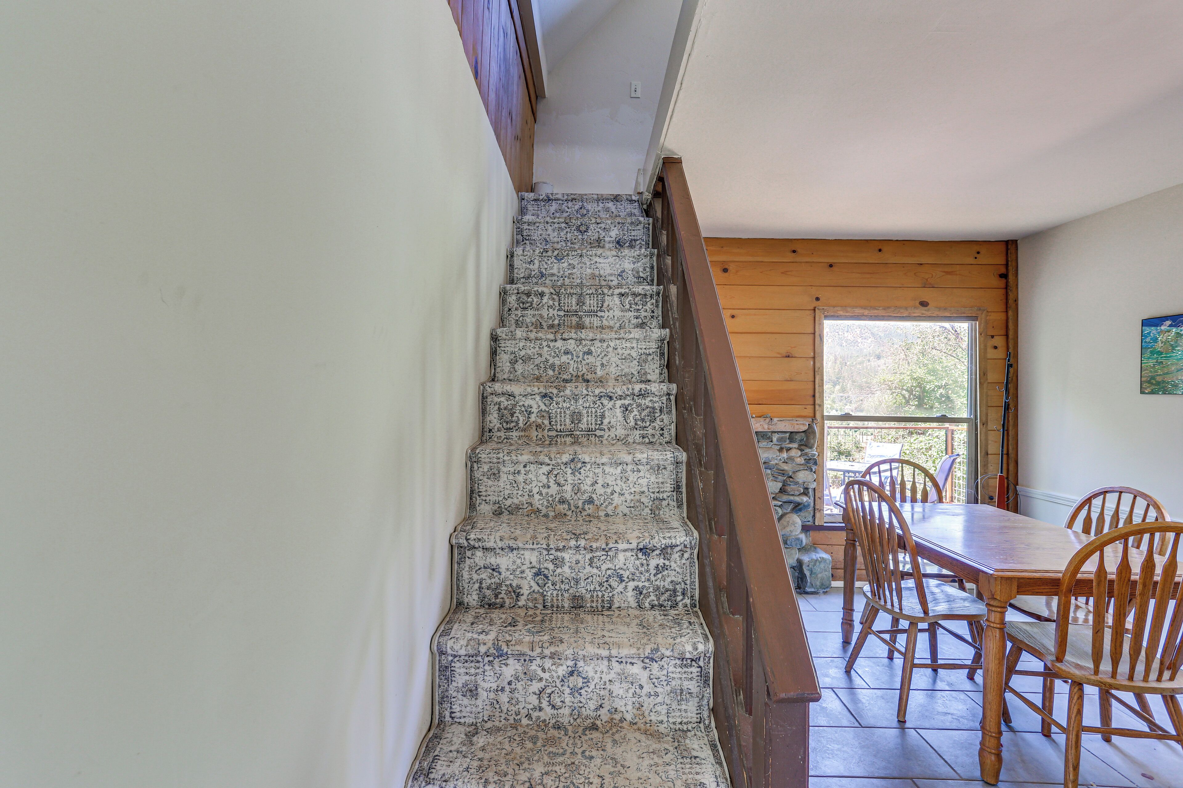 A staircase with patterned steps leading to a wooden door.