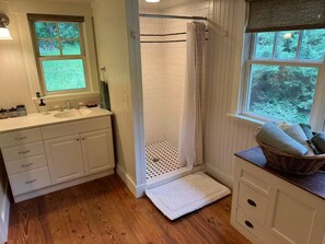 Shower, towels, soap, toilet paper