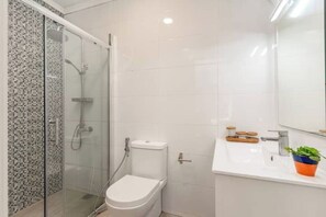 Shower, towels, soap, toilet paper