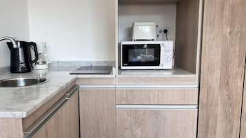 Fridge, microwave, coffee/tea maker, toaster