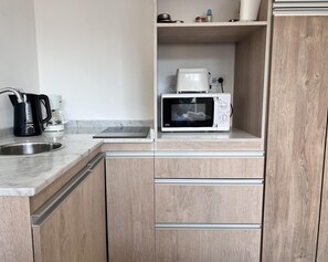 Fridge, microwave, coffee/tea maker, toaster