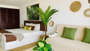 A bedroom with a bed, a sofa, a potted plant, and a large painting on the wall.