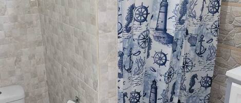 Shower, towels, soap, toilet paper