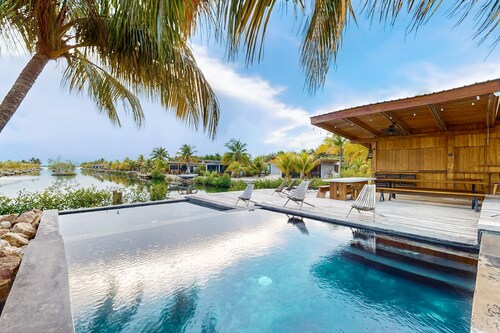 Waterfront villa with splash pool, private terrace, beach access & WiFi