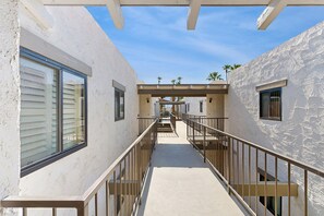 Property grounds - Dive into Palm Springs fun with a stylish home base featuring poolside lounging. (Palm Springs)