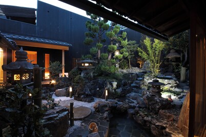 The Tenpō luxury Kyomachiya with outdoor rock bath, garden, and private sauna.