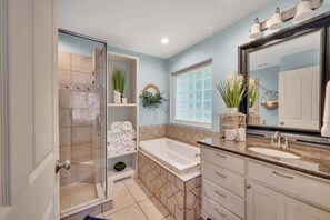Shower, hair dryer, towels, shampoo