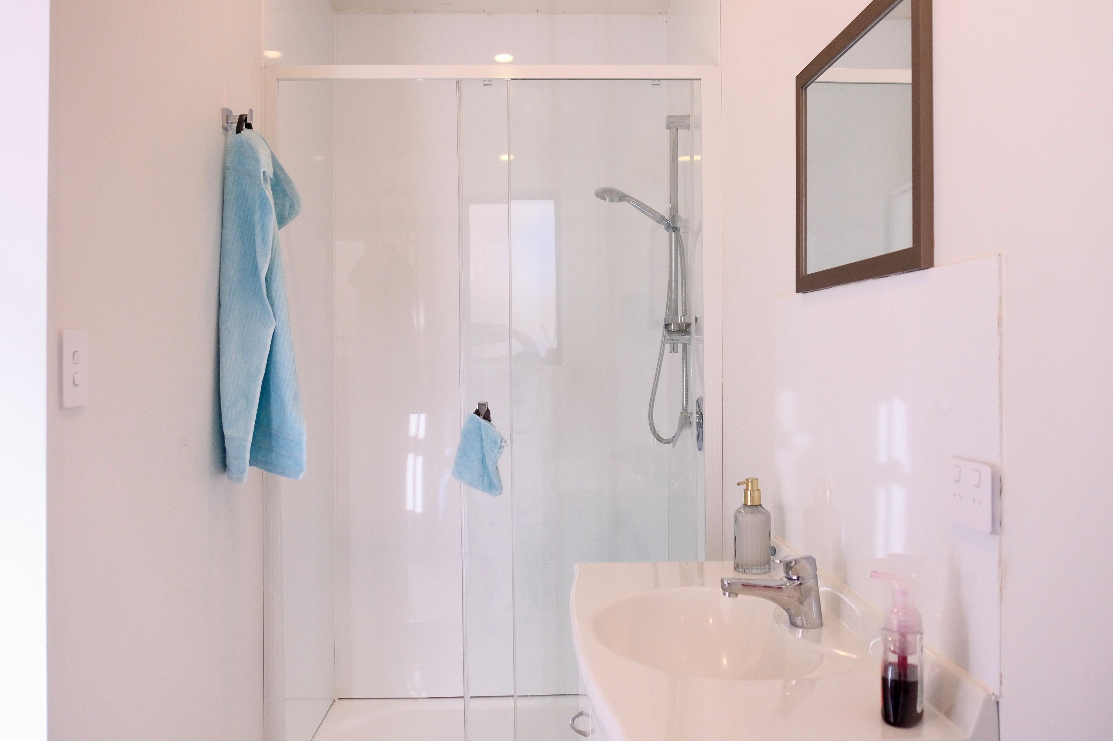 Shower, towels, soap, toilet paper