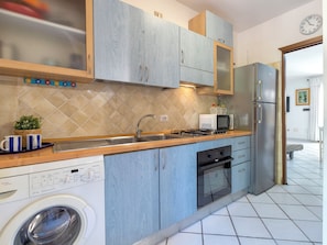 Fridge, microwave, cookware/dishes/utensils