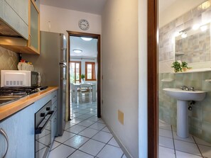 Fridge, microwave, cookware/dishes/utensils