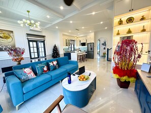 Deluxe Villa, 3 Bedrooms, Balcony, Garden View | Living area | 55-inch LED TV with cable channels, streaming services - Cherry Villa - Novaworld Phan Thiet (Phan Thiet)