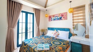 A bedroom with a bed, curtains, a window, a wall art piece, and a bedside table.