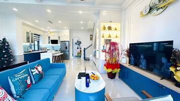 Deluxe Villa, 3 Bedrooms, Balcony, Garden View | Living area | 55-inch LED TV with cable channels, streaming services