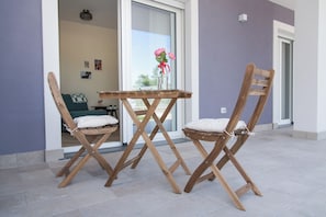 Family Triple Room, Ensuite, Garden View | Terrace/patio