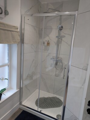 Shower, hair dryer, towels, soap