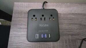 A NUGZI power strip with multiple USB ports and a standard electrical outlet. - Clean Spacious 3BR, ½ Mi to Hospital, Near Universities, Fast WiFi, Pet-Friendly (Princeton)