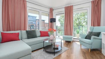 Apartamento conforto | Área de estar | Smart TV 50 polegadas com canais a cabo