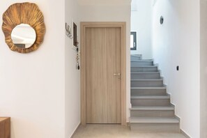 Family Villa | Living area | 55-inch Smart TV with digital channels