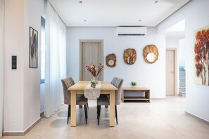 Family Villa | Living area | 55-inch Smart TV with digital channels