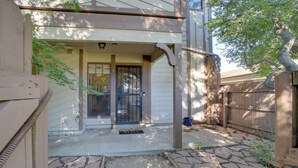 A house with a covered porch, a front door, and a mailbox. - 10 Mi to Dtwn Tulsa: Condo w/ Pool Access! (Tulsa)