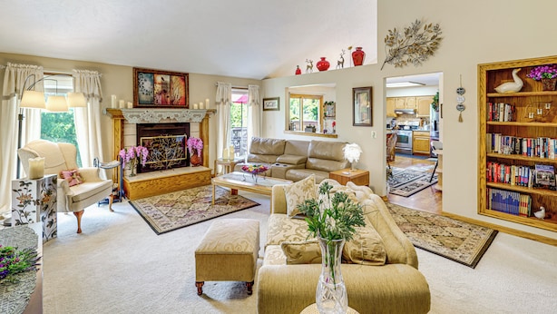 A spacious living room with a fireplace, a sofa, a coffee table, and a bookshelf. - 5 Mi to Platte River: Inviting Bellevue Rental (Bellevue)