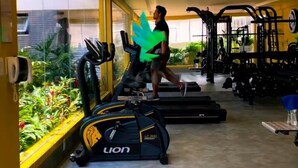 A gym with treadmills, weight machines, and a view of greenery outside. - Breeze Residence duplex penthouse, Belém do Pará, for cop30 (Val-de-Cans Belém)