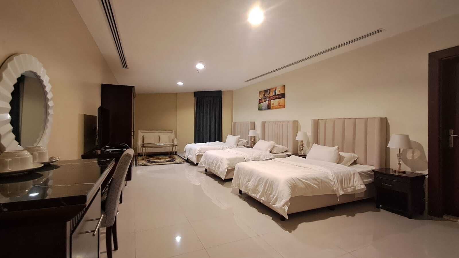 Deluxe Triple Room, City View | In-room safe, desk, laptop workspace, iron/ironing board