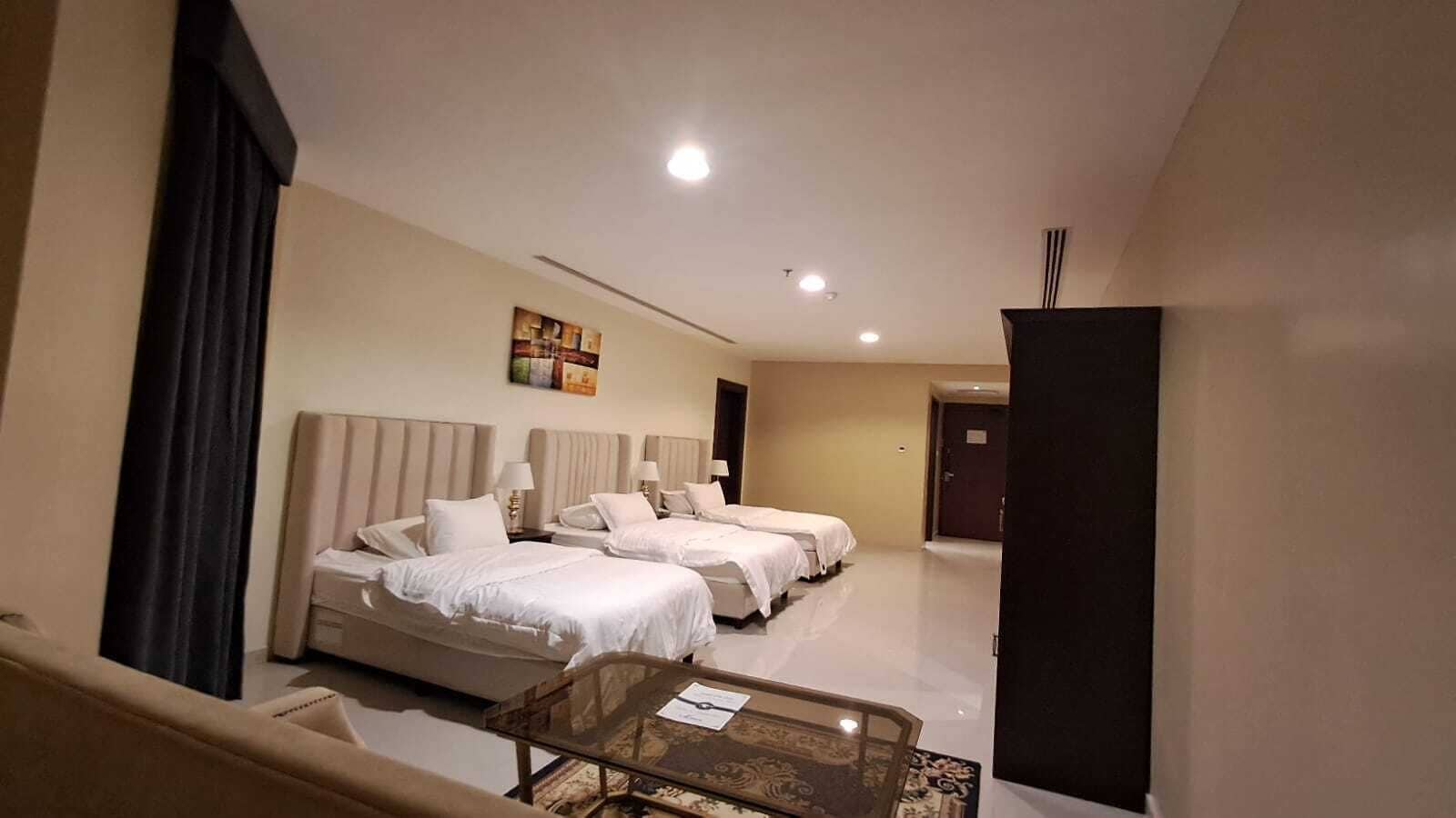 Deluxe Triple Room, City View | In-room safe, desk, laptop workspace, iron/ironing board