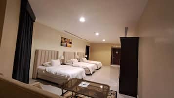 Deluxe Triple Room, City View | In-room safe, desk, laptop workspace, iron/ironing board