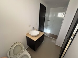 Shower, towels, soap, toilet paper