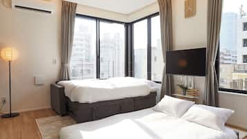 Premium Condo | Living area | 50-inch flat-screen TV with digital channels