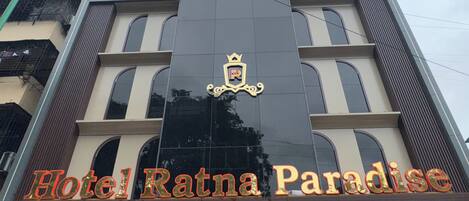 The facade of Hotel Ratna Paradise with its prominent signage and architectural details.