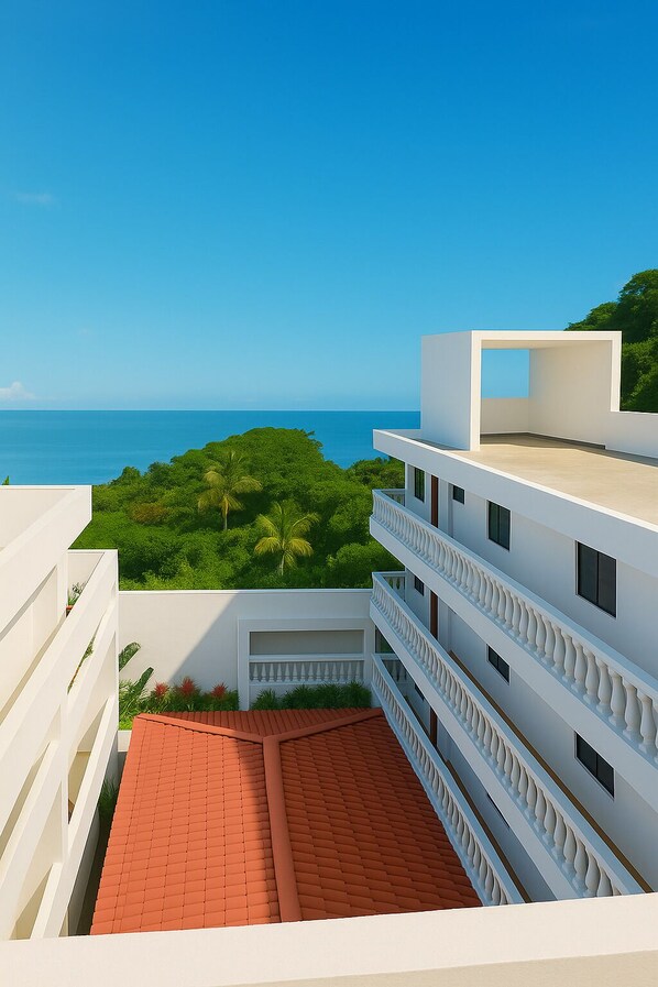 Chambre quadruple familiale, balcon, vue sur la mer | Terrasse/patio