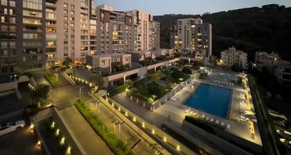 Apartment in Tilal Fanar, Terrace, great for BBQ, pools, wifi,gym,parking,security