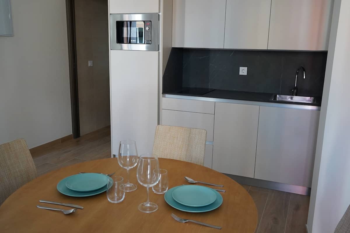 Deluxe Suite, Balcony, City View | Private kitchen | Full-sized fridge, microwave, stovetop, cookware/dishes/utensils