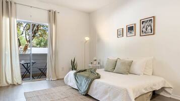 1 bedroom, desk, iron/ironing board, travel crib