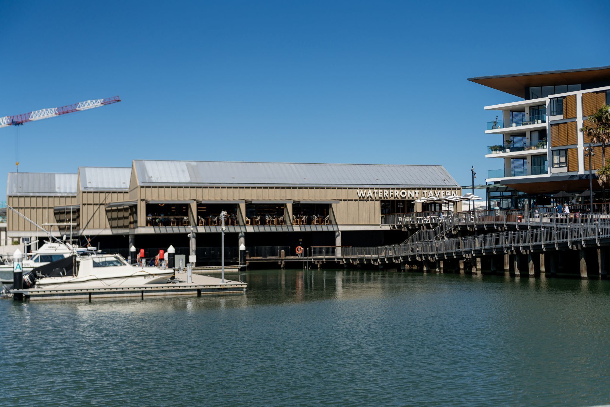 A waterfront building with a sign reading "Waterfront Tavern."