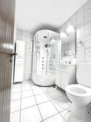 Shower, hair dryer, towels, soap