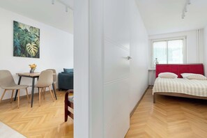 1 bedroom, desk, iron/ironing board, travel crib