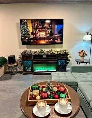 Smart TV, fireplace, books, stereo