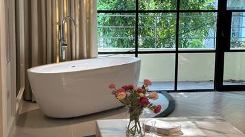 Separate bathtub and shower, free toiletries, hair dryer, slippers