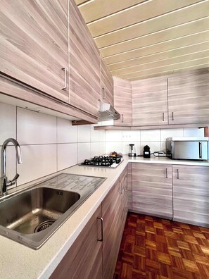 Microwave, stovetop, coffee/tea maker, toaster
