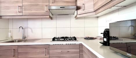 Microwave, stovetop, coffee/tea maker, toaster