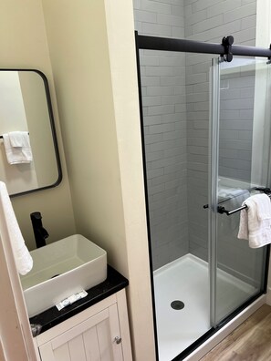 Shower, hair dryer, towels, soap