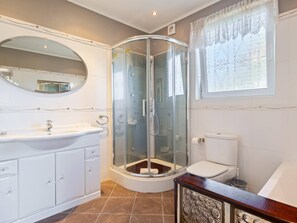 Shower, hair dryer, towels, shampoo